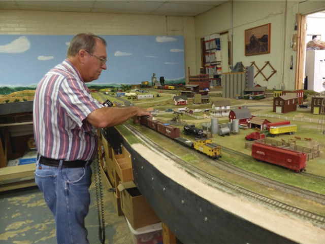 There has been much squawking about continuous construction photos 
		and nothing about operation of the layout. So here is one of the participants, 
		Paul F, doing what is known as "Leroying" a train.